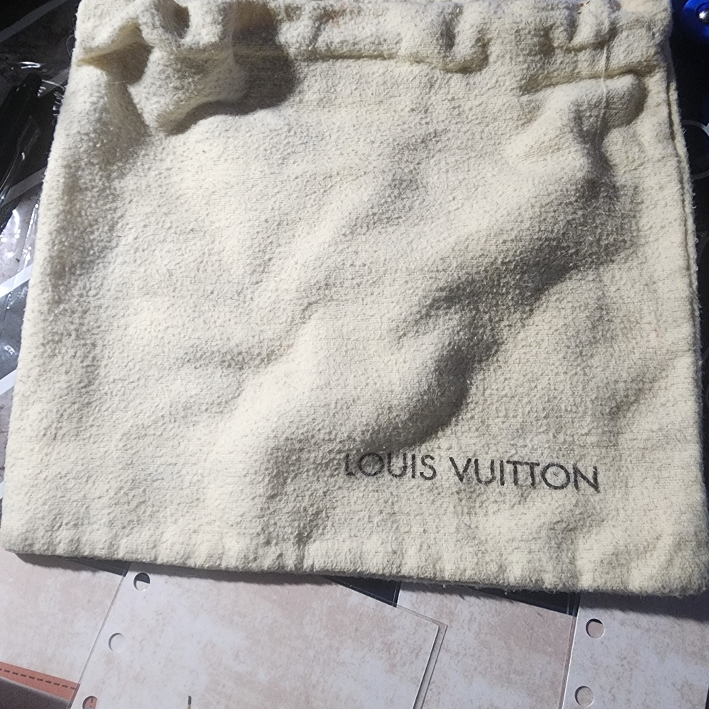 LV Swag.The dust bag is actually  darker than the picture.